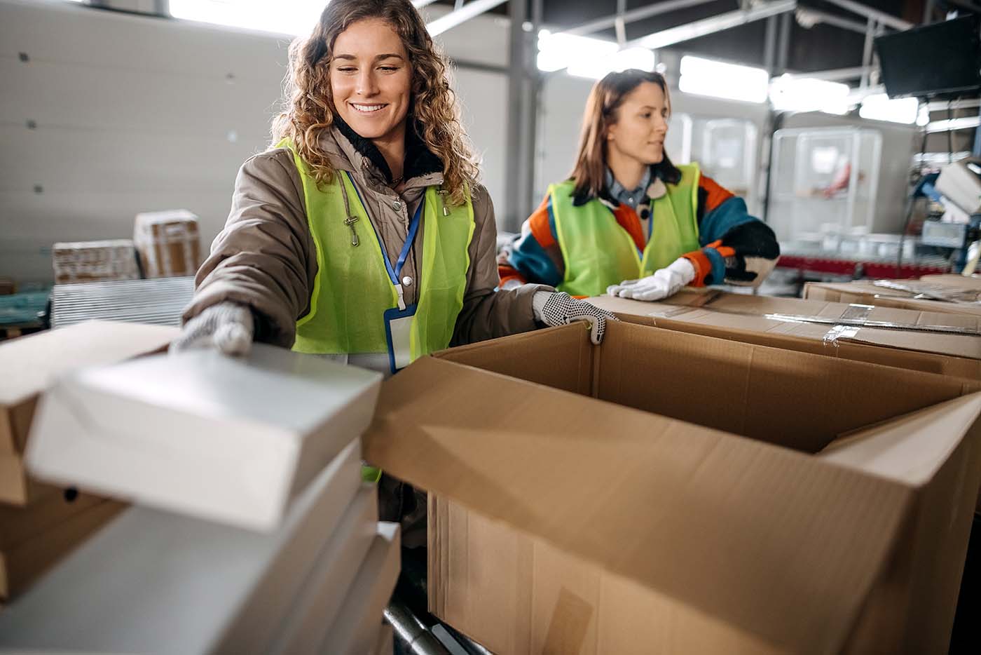 Women working in distribution warehouse